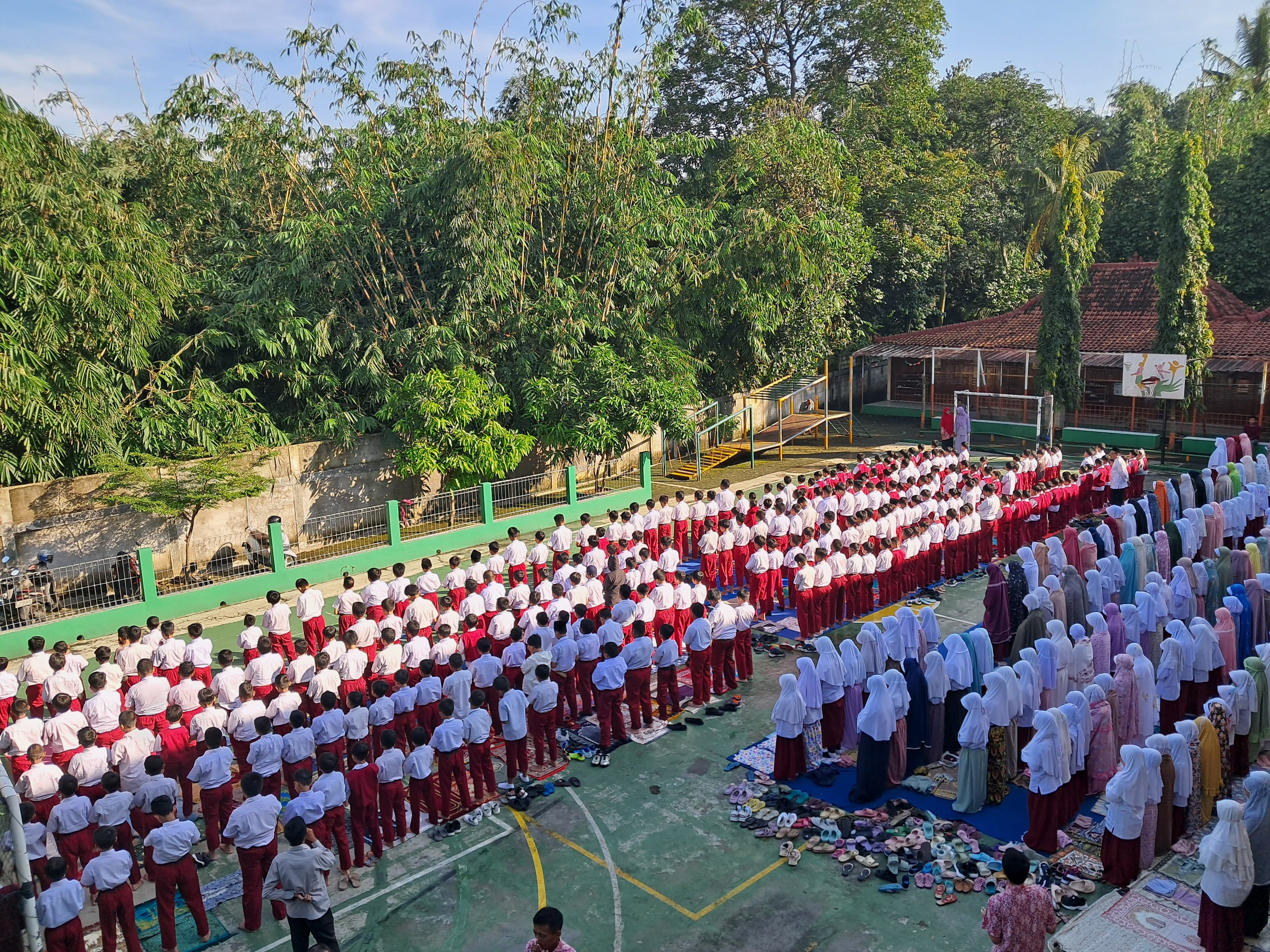 Model wearing plain stone basic tee.